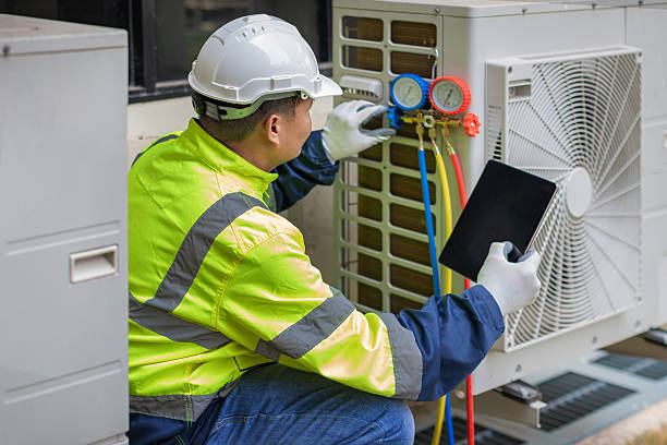 Professional Heat Pump Repair technician working in Brewster, OH